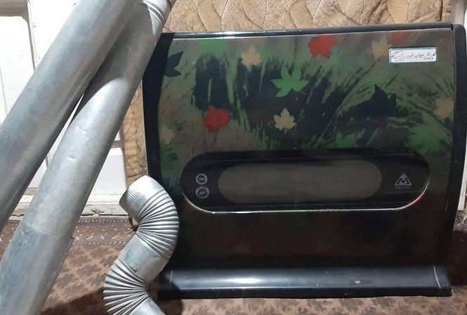 یک بخاری گازی همرا با لوله هایش