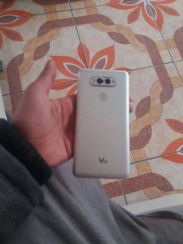 گوشی LGV20اصلی همه کارش چک بدون مشکل فقط شیشه کامره پشتش شکس